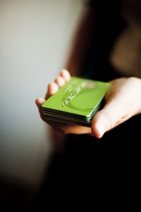 hand-holding-stack-of-green-credit-cards-2026-09-22-16-52-28-utc